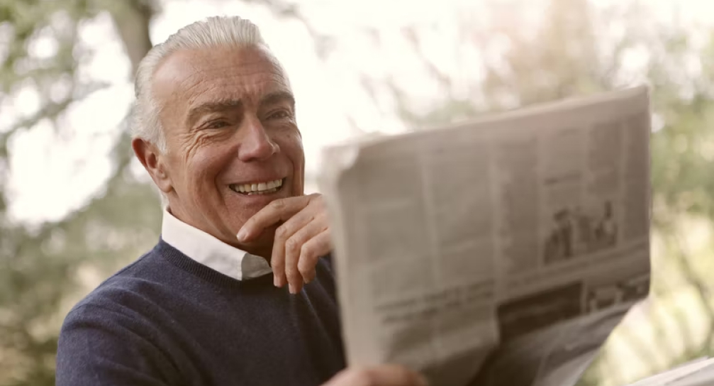 Man enjoying clear vision while reading outdoors