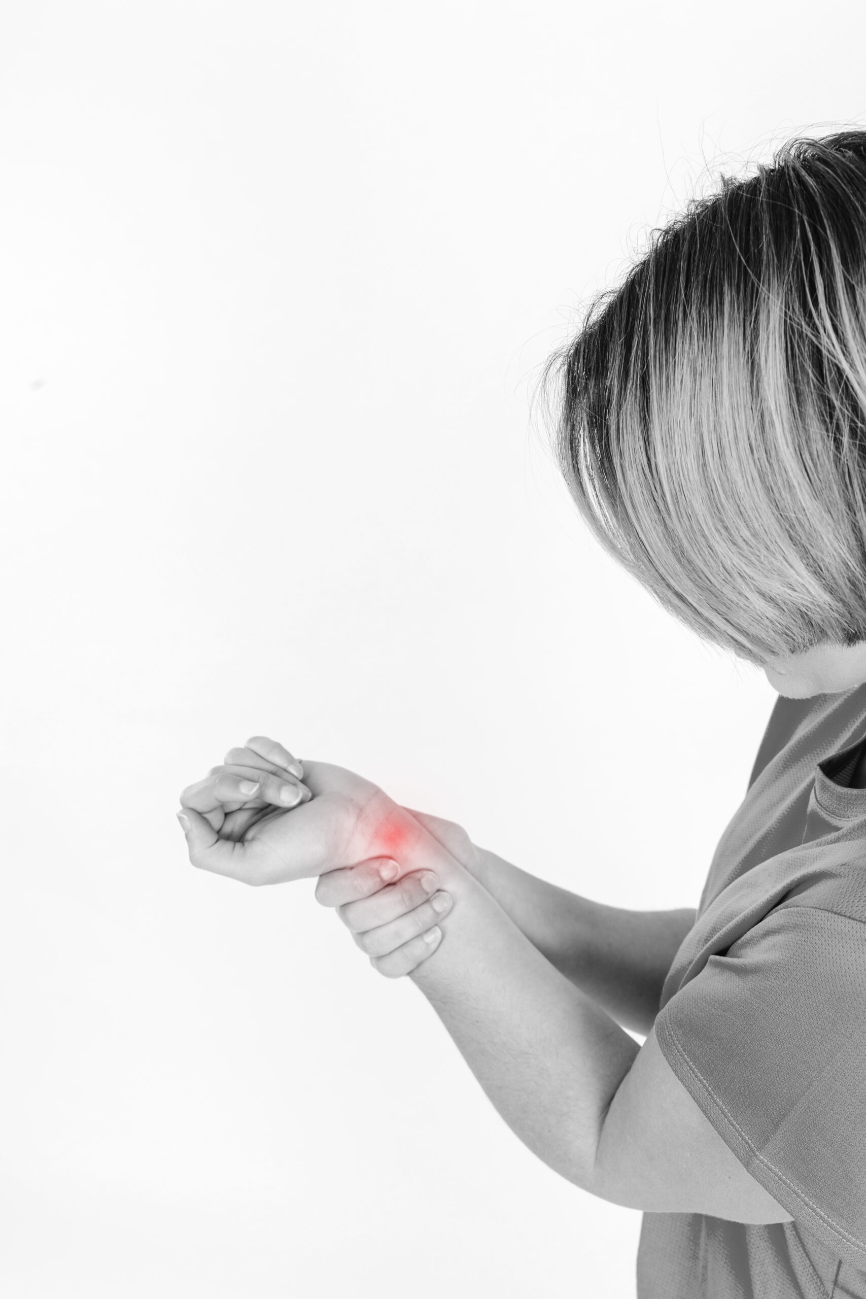 Person holding a painful wrist